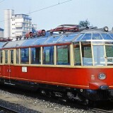 BR_491_E_91_glaserner_Zug_rot_beige_Bahnhof_Heidelbrg_1967